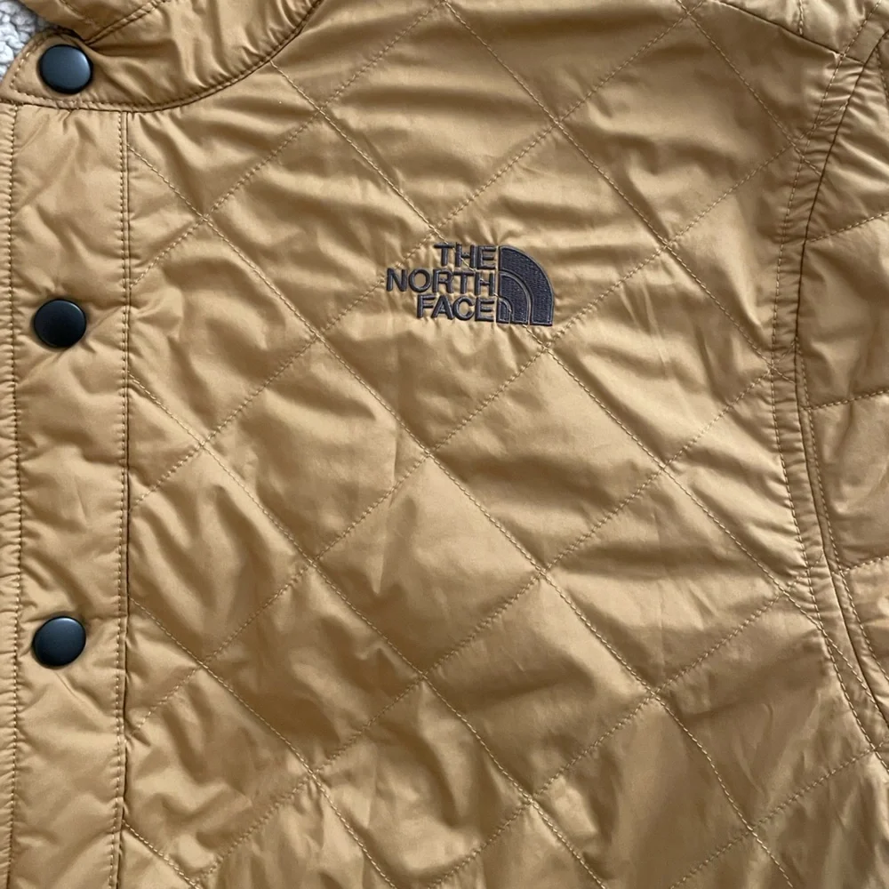 The North Face mustard brown